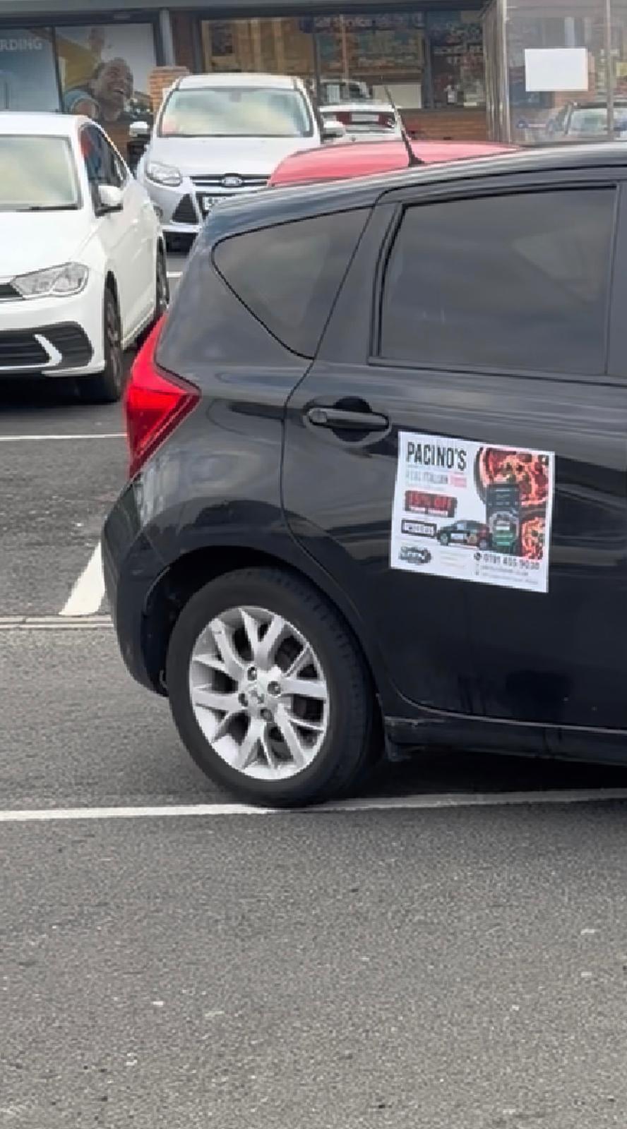 Example of a local restaurant advert displayed on a car